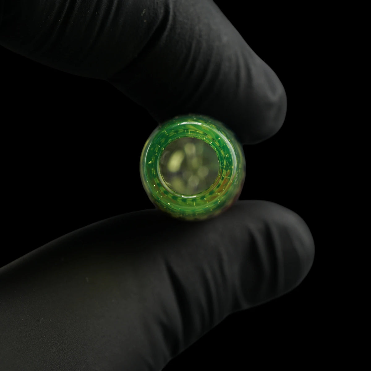Close-up of the round mouthpiece opening on the Leisure Glass Lime Flux glass tip with transparent lime green glass