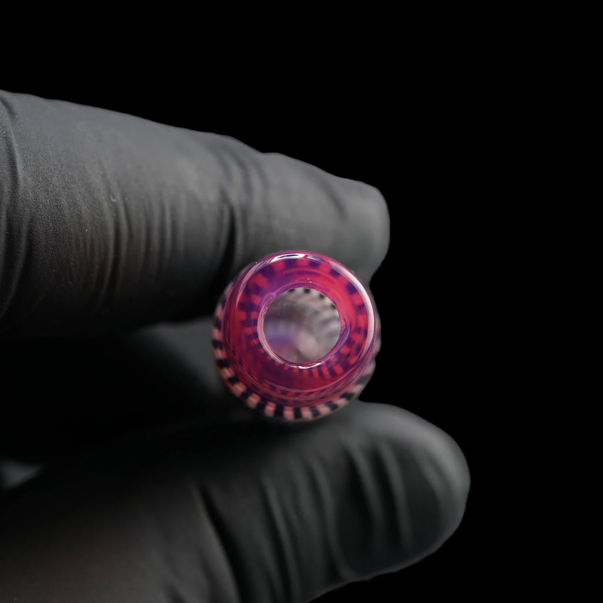 Close-up of the round mouthpiece opening on the Leisure Glass Pink Reverie Hypnotech glass tip with a pink rim and violet reflections
