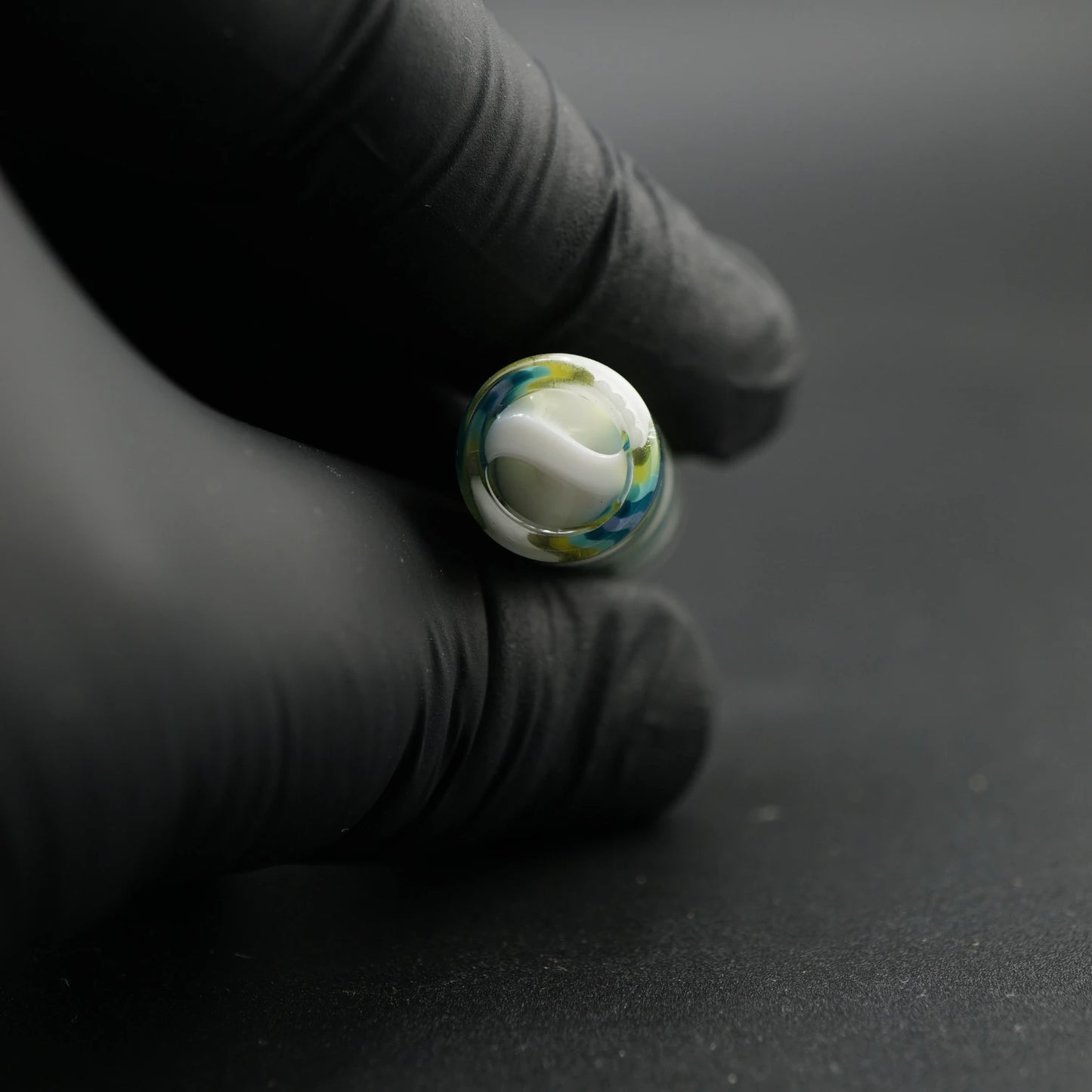 Close-up of the white spiral Rotini filter inside the Tyeglassarts Ocean Mist glass tip
