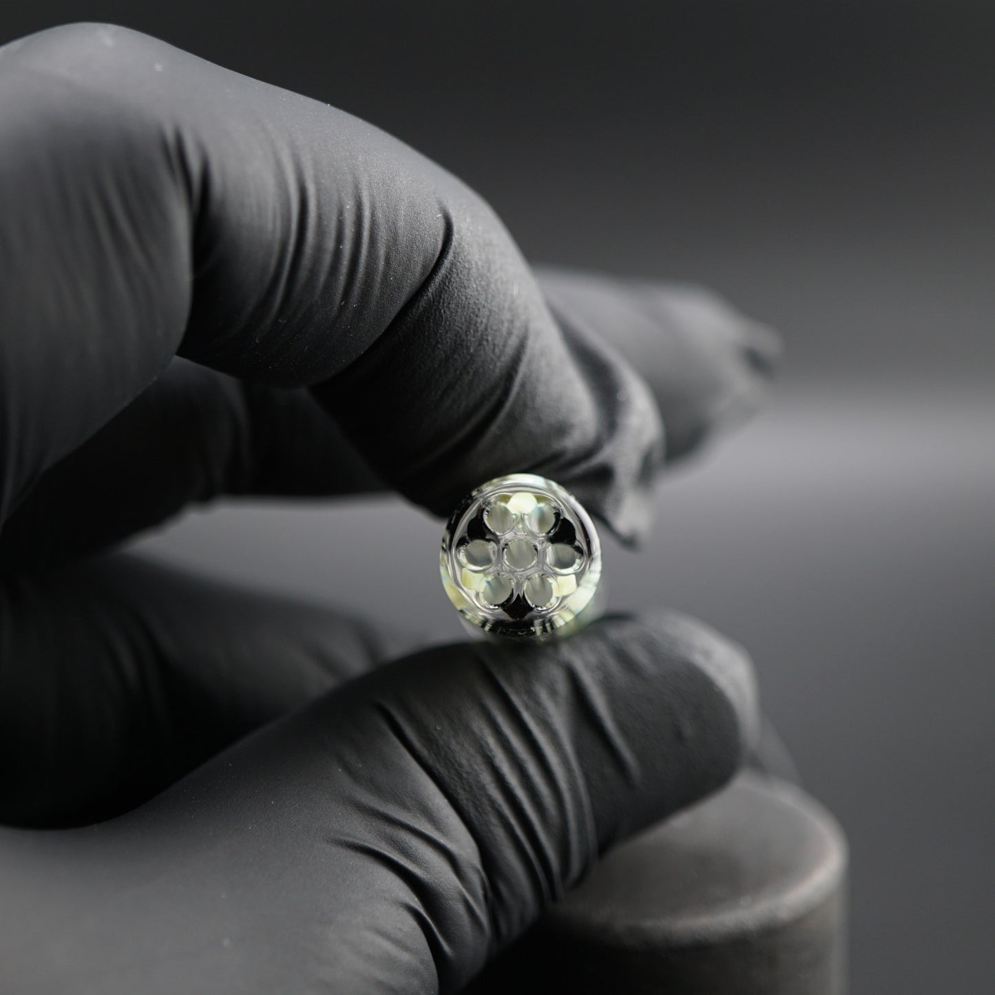 Close-up of the black sparkle core inside the Obsidian Ghost collector glass tip by Blazing Blue Glass