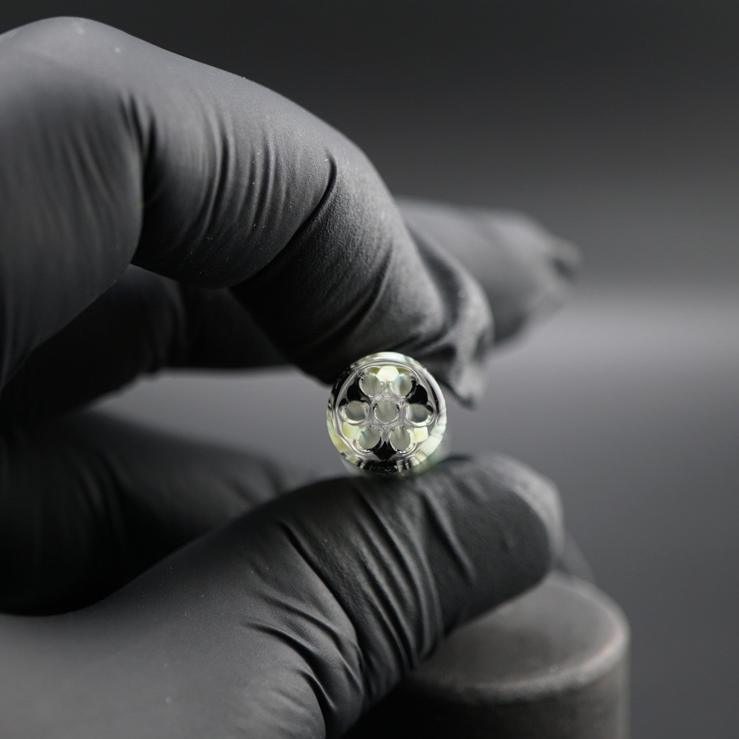 Close-up of the black sparkle core inside the Obsidian Ghost collector glass tip by Blazing Blue Glass