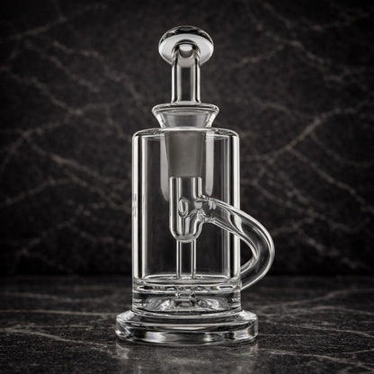 Clear glass dab rig shown from the back with cylindrical chamber and clean glass mouthpiece