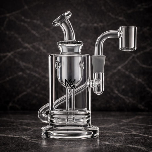 Clear glass dab rig with transparent mouthpiece photographed from the front in dark studio lighting