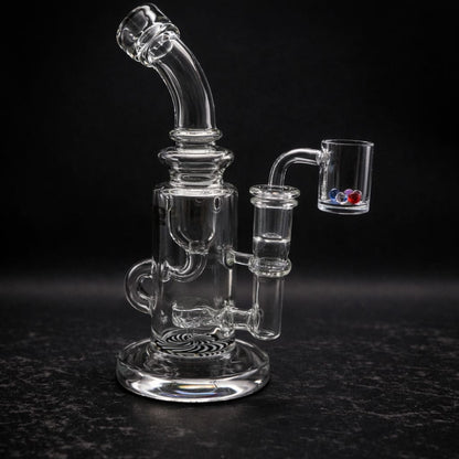 Clear glass dab rig side view with banger connection and curved mouthpiece