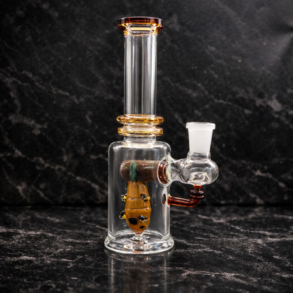 Empire Glassworks Save the Bees dab rig made from borosilicate glass with honey bee lampwork design on dark marble background
