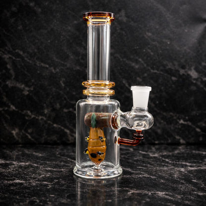 Empire Glassworks Save the Bees dab rig made from borosilicate glass with honey bee lampwork design on dark marble background