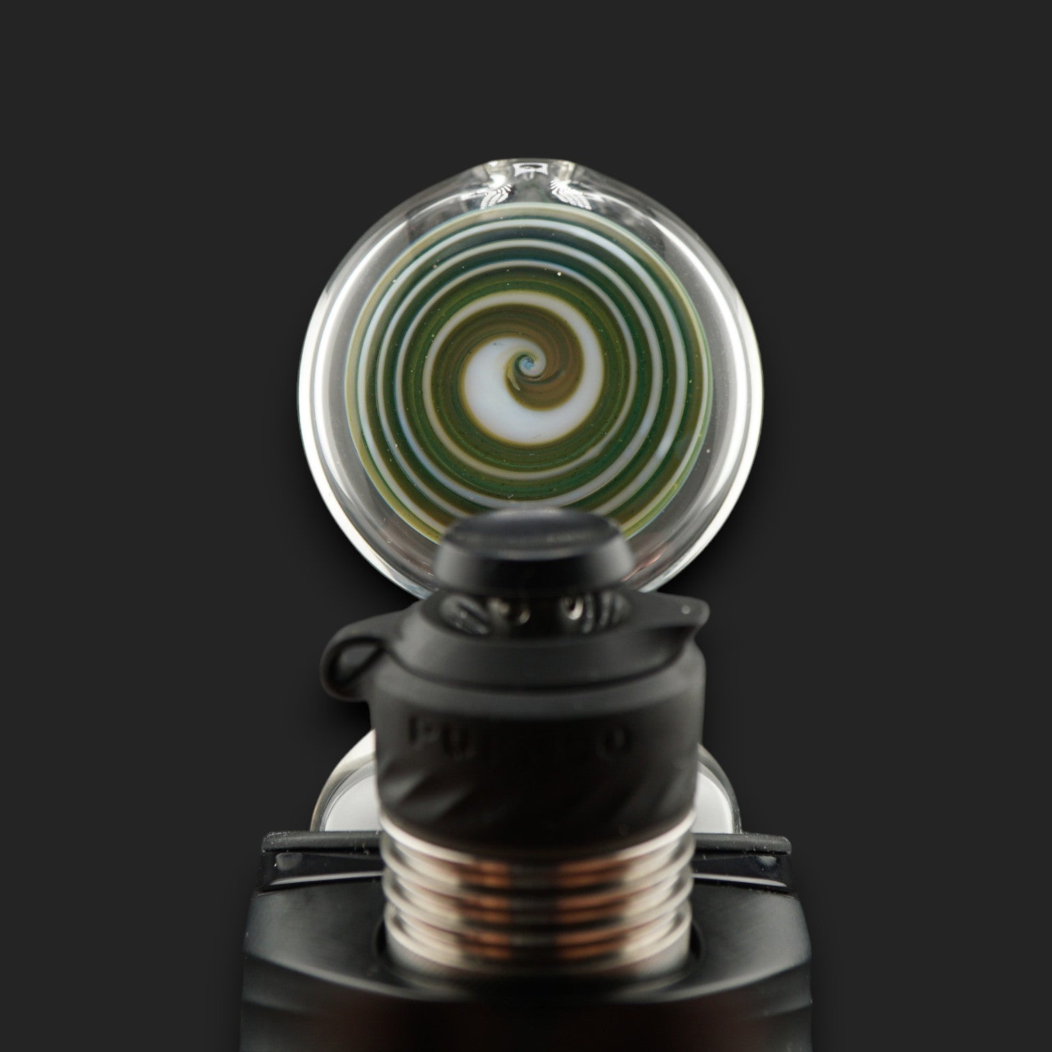Close-up of the Forest Eye spiral showcasing green, blue and earthy tones with subtle sparkling accents.