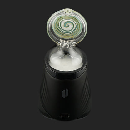 Handmade Forest Eye dry top by Nobullglassworks for the Puffco Peak and Peak Pro featuring a green spiral design.