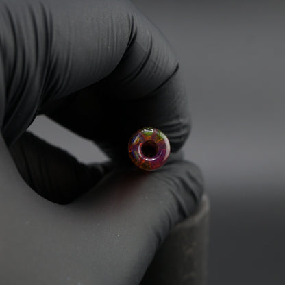 Iridescent borosilicate glass tip for joints close-up