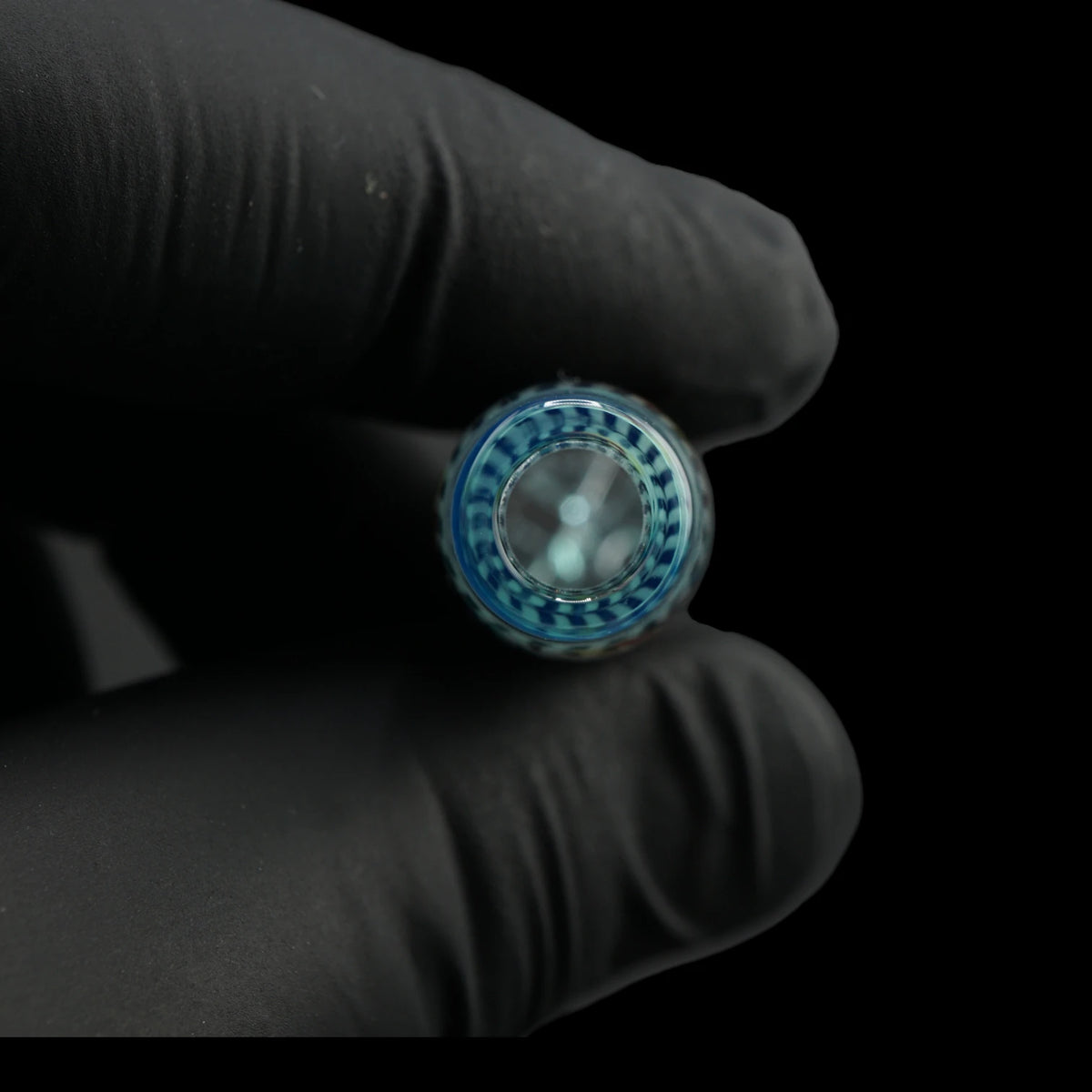 Close-up of the round mouthpiece opening on the Leisure Glass Aqua Current glass tip with transparent aqua blue glass