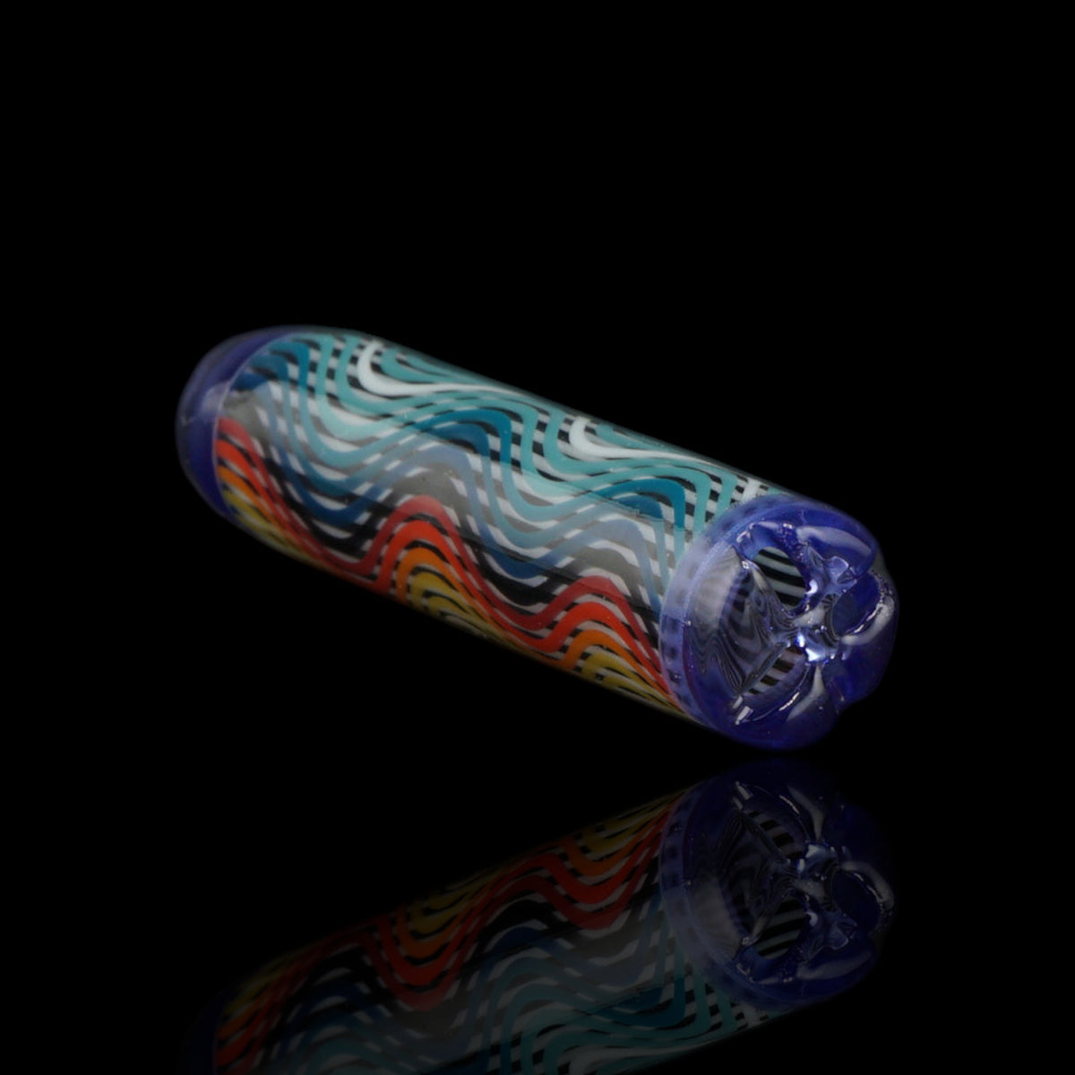 Angled view of the Leisure Glass Blue Pulse glass tip showing turquoise, blue, red, orange and yellow waves with blue ends
