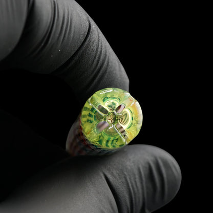 Close-up of the yellow-green filter end on the Leisure Glass Citrus Prism Hypnotech glass tip showing four openings