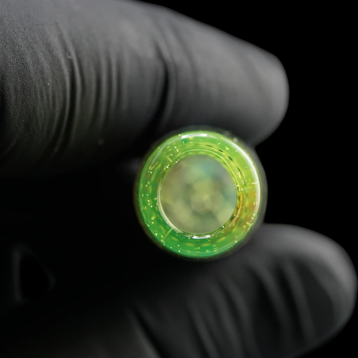 Close-up of the round mouthpiece opening on the Leisure Glass Citrus Prism Hypnotech glass tip with a transparent yellow-green rim