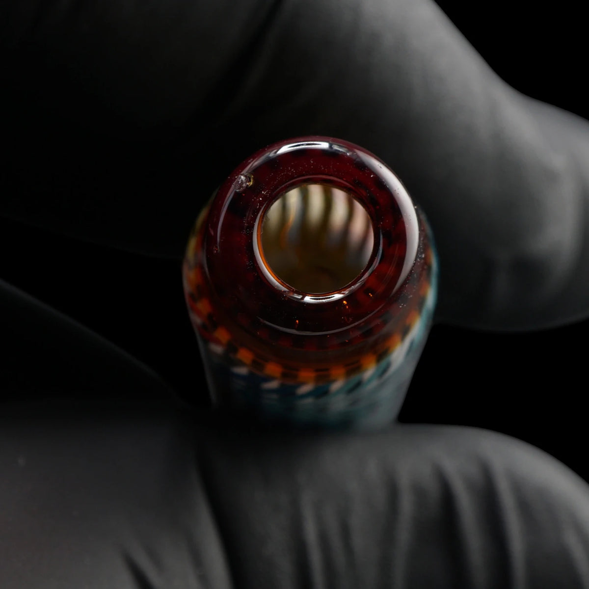 Close-up of the round mouthpiece opening on the Leisure Glass Ember Wave glass tip with transparent dark orange-brown glass
