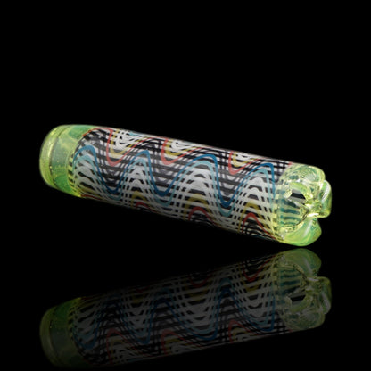 Angled view of the Leisure Glass Lime Echo glass tip showing fine Hypnotech waves in black, white, blue, turquoise, red and yellow