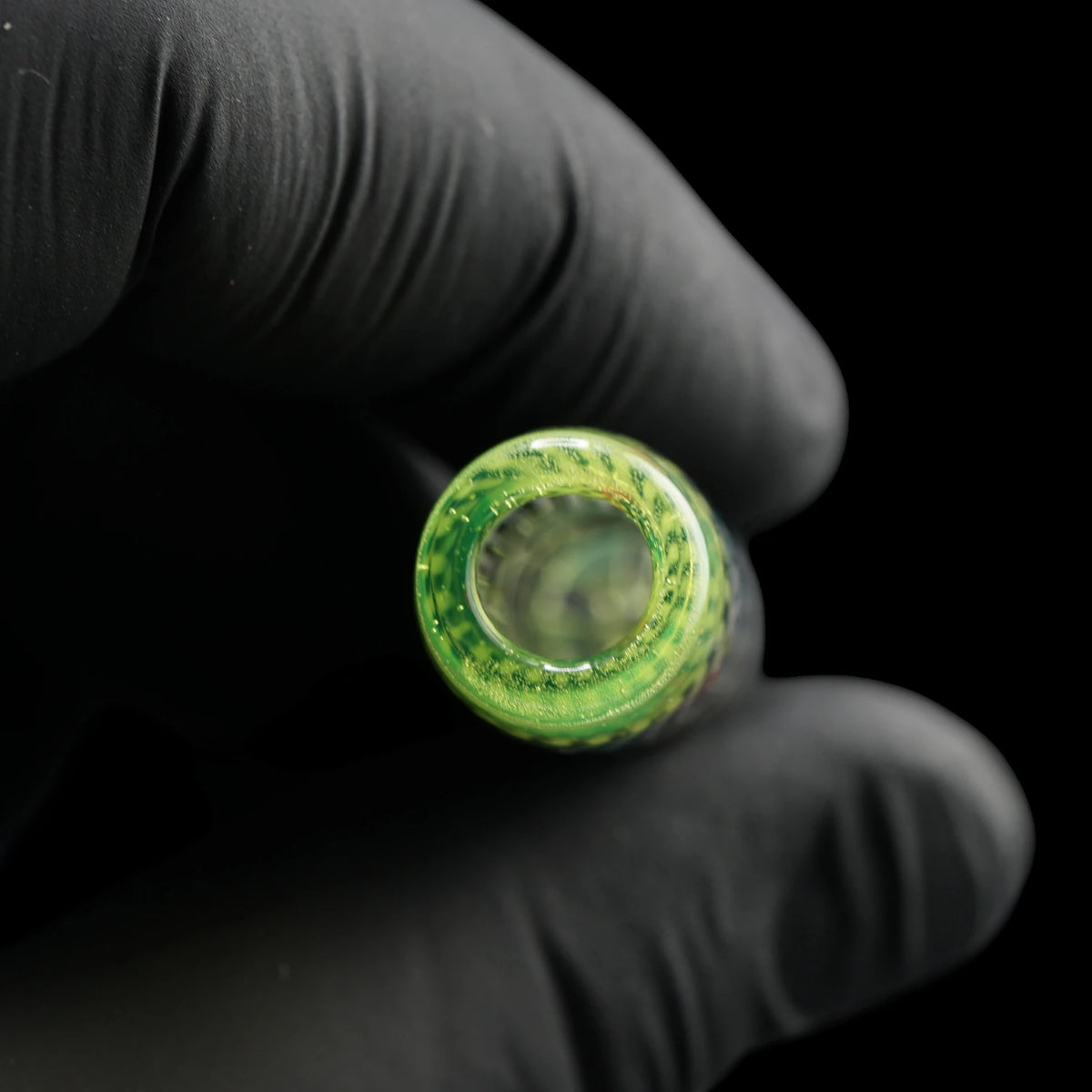 Close-up of the round mouthpiece opening on the Leisure Glass Lime Echo glass tip with transparent lime green glass
