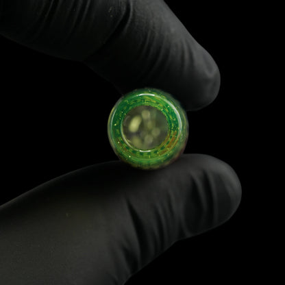 Close-up of the round mouthpiece opening on the Leisure Glass Lime Flux glass tip with transparent lime green glass