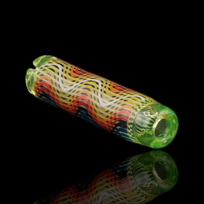 Angled view of the Leisure Glass Lime Mirage Hypnotech glass tip showing colorful waves and a lime green opening