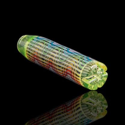 Angled view of the Leisure Glass Lime Reactor UV glass tip showing rainbow Hypnotech waves and yellow-green UV-reactive ends