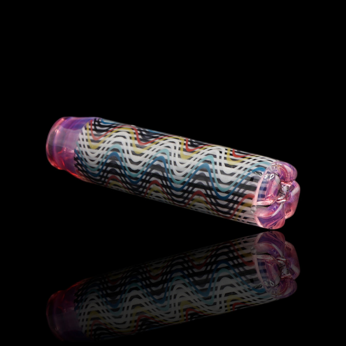 Angled view of the Leisure Glass Pink Reverie glass tip showing its multicolored Hypnotech wave pattern and transparent pink ends