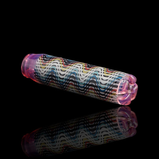 Angled view of the Leisure Glass Pink Reverie glass tip showing its multicolored Hypnotech wave pattern and transparent pink ends