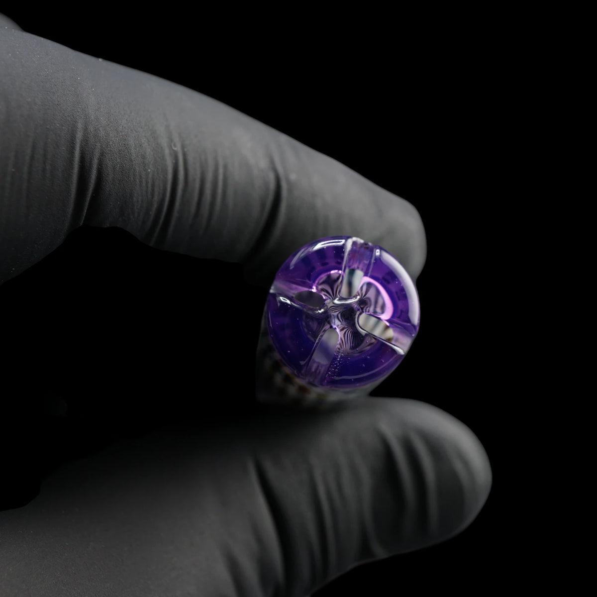 End view of the Leisure Glass Purple Haze Hypnotech glass tip showing four airflow openings and its purple glass filter structure