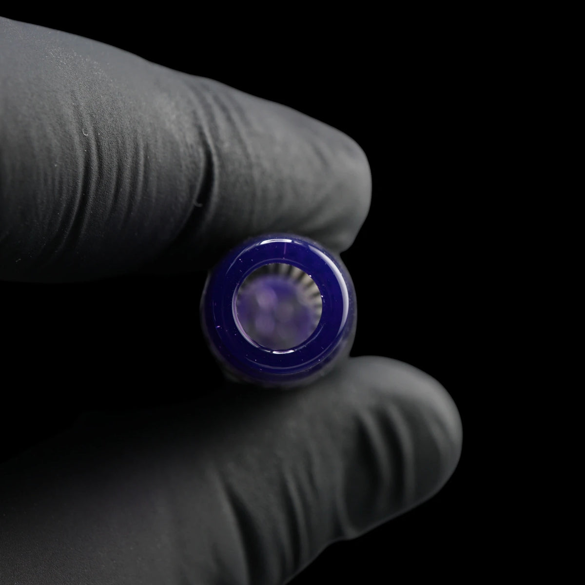 Close-up of the round mouthpiece opening on the Leisure Glass Purple Haze glass tip with transparent purple glass