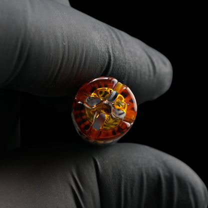 Close-up of the filter end on the Leisure Glass Sienna Drift Hypnotech glass tip showing four openings and amber-colored reflections