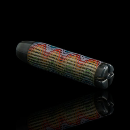 Angled view of the Leisure Glass Silver Spectrum glass tip showing its rainbow wave pattern and dark silver metallic end