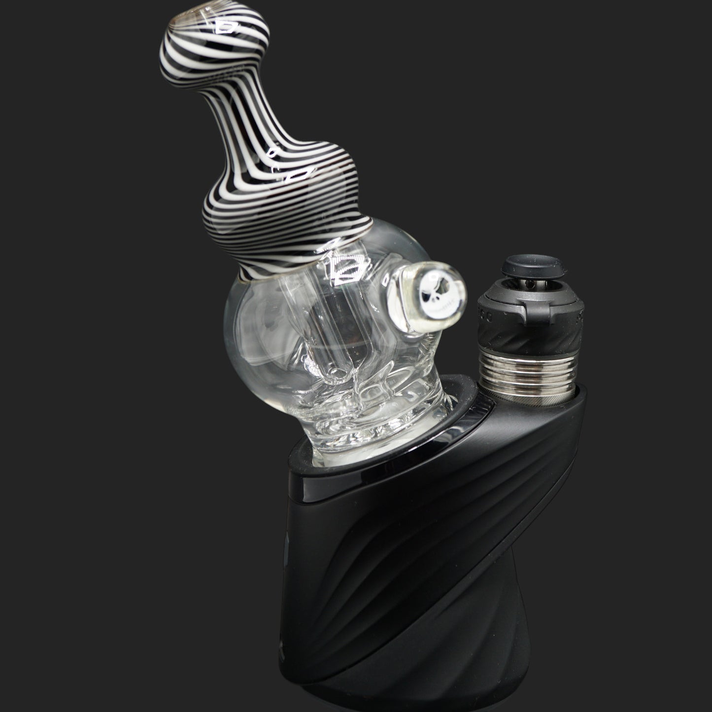 Detailed view of the Mind Blowing Glass Skull Spiral wet top highlighting the black and white ribbon pattern and sculpted glass artwork.