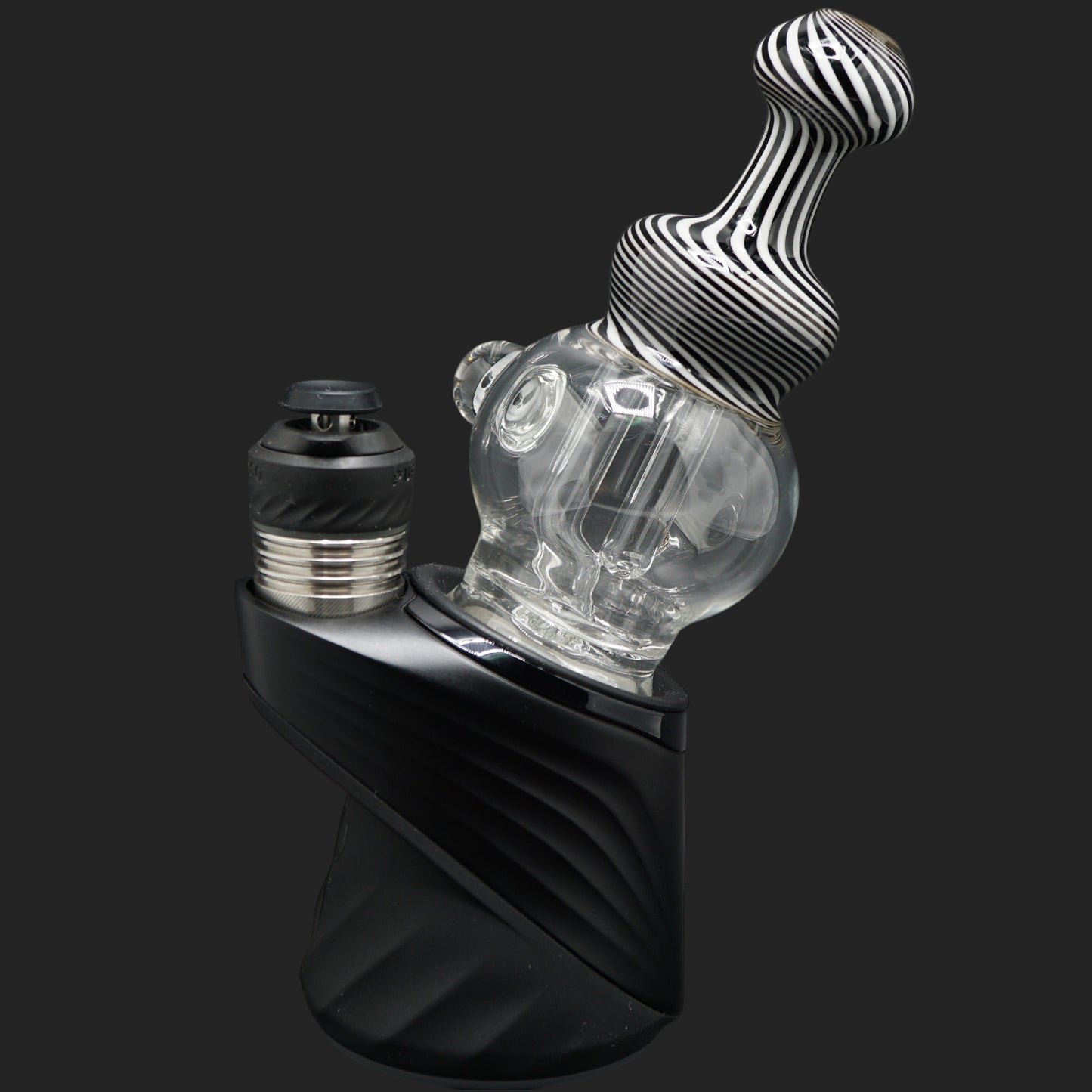 Front angle view of the Mind Blowing Glass Skull Spiral wet top featuring black and white spiral linework for the Puffco Peak Pro.