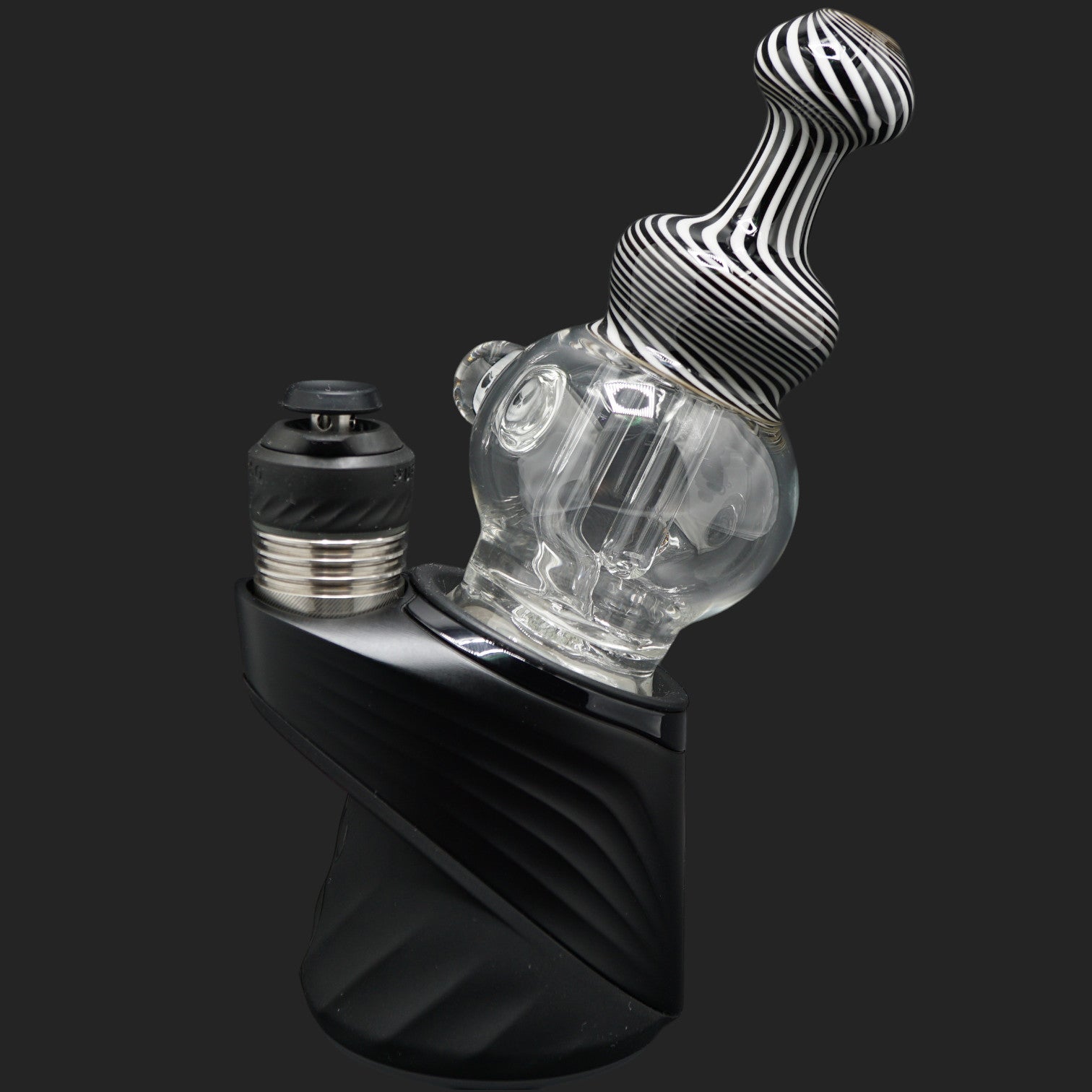 Front angle view of the Mind Blowing Glass Skull Spiral wet top featuring black and white spiral linework for the Puffco Peak Pro.