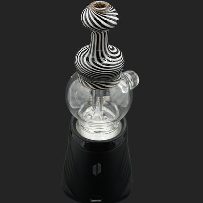Front angle view of the Mind Blowing Glass Skull Spiral wet top featuring black and white spiral linework for the Puffco Peak Pro.