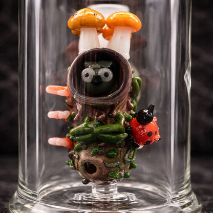 Detailed view of the owl and mushroom design inside the Renew the Redwood dab rig