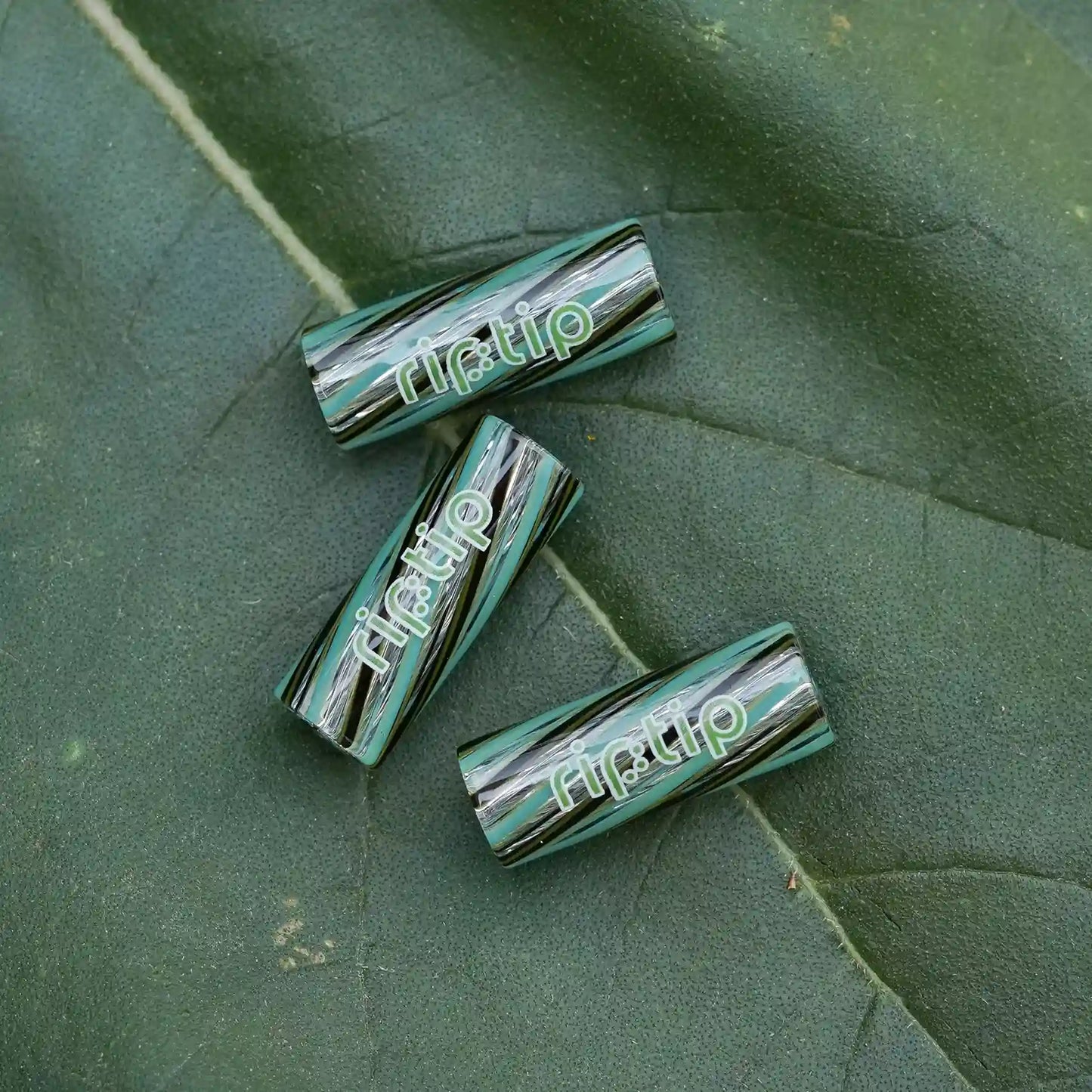 Three RipTip Amazonite glass tips with turquoise black and clear spiral design