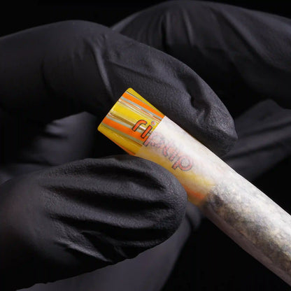 RipTip Frizzle glass tip for joints with yellow orange and aqua striped design in use