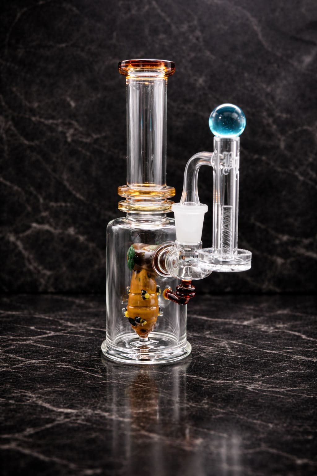 Save the Bees dab rig by Empire Glassworks shown with optional terp slurper and pillar set on dark studio background