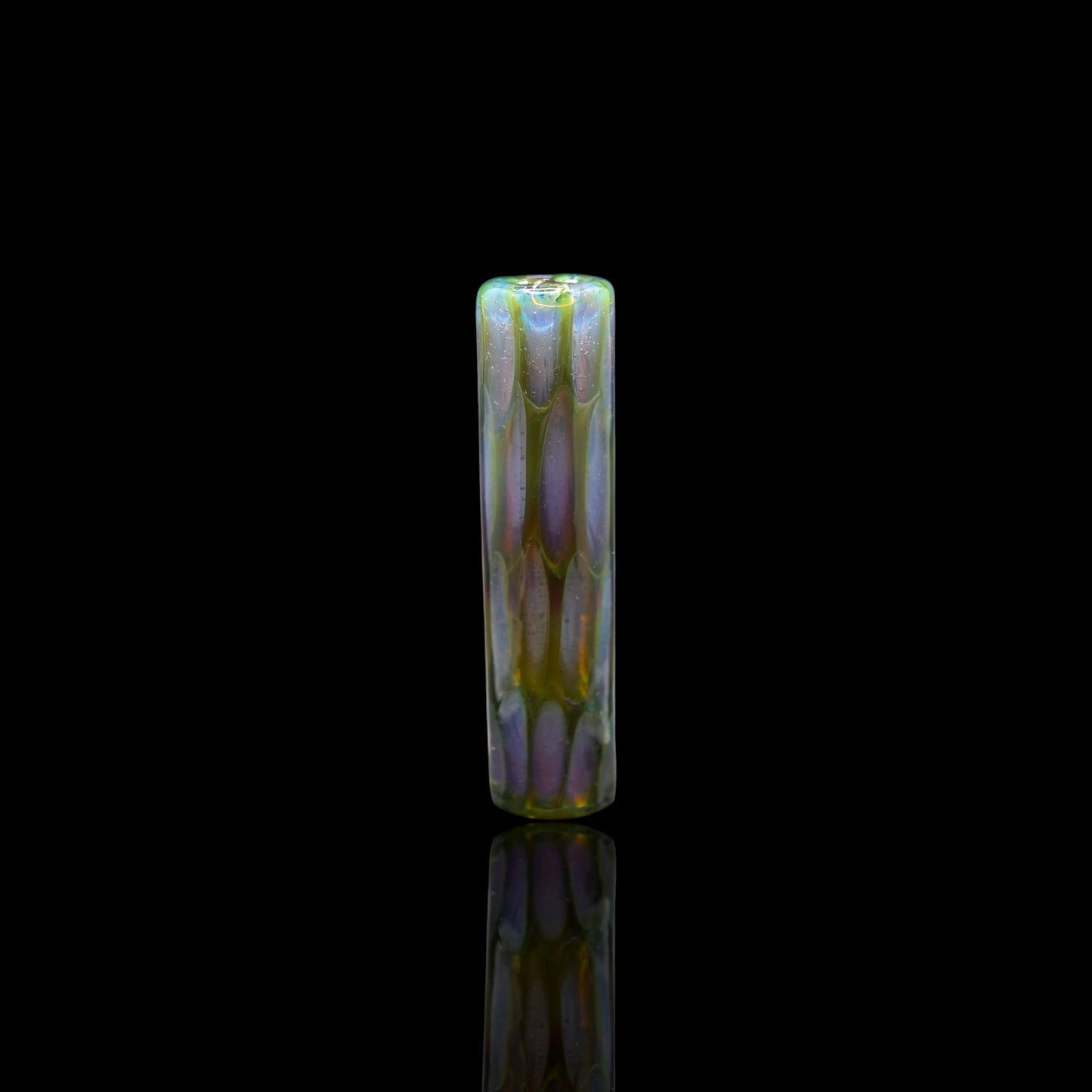 Handmade SteveHGlass borosilicate glass tip in 11 mm with iridescent purple, green and yellow design on black background.