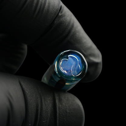 Macro view of the signature spiral Rotini filter inside the Tyeglassarts Deep Blue Sea glass joint tip