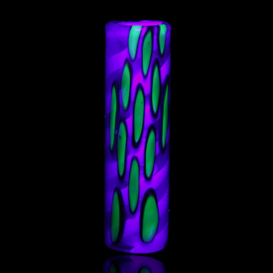 Ghost Orchid UV reactive glass tip glowing vivid purple with bright green botanical accents under blacklight