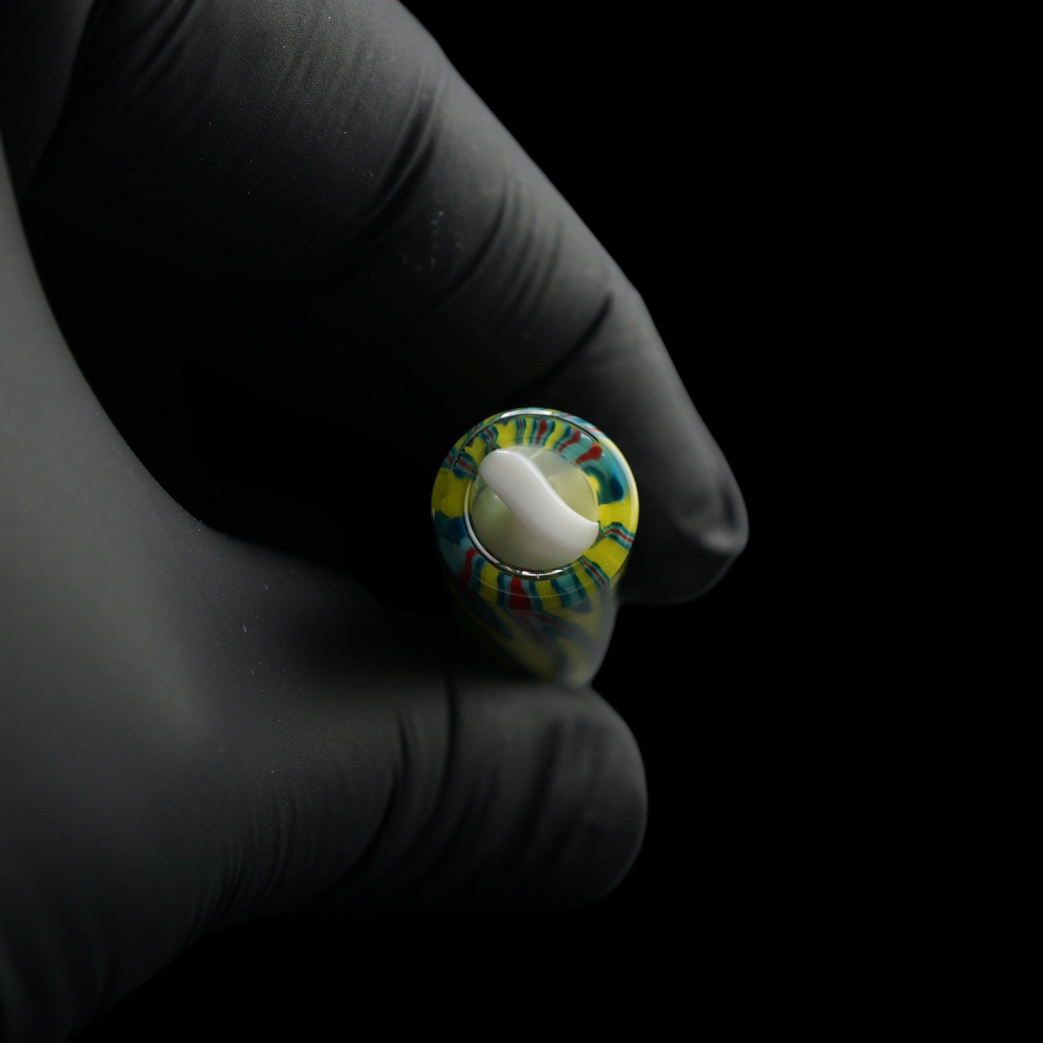 Close-up of the white spiral Rotini filter inside the Tyeglassarts Lime Vortex glass tip