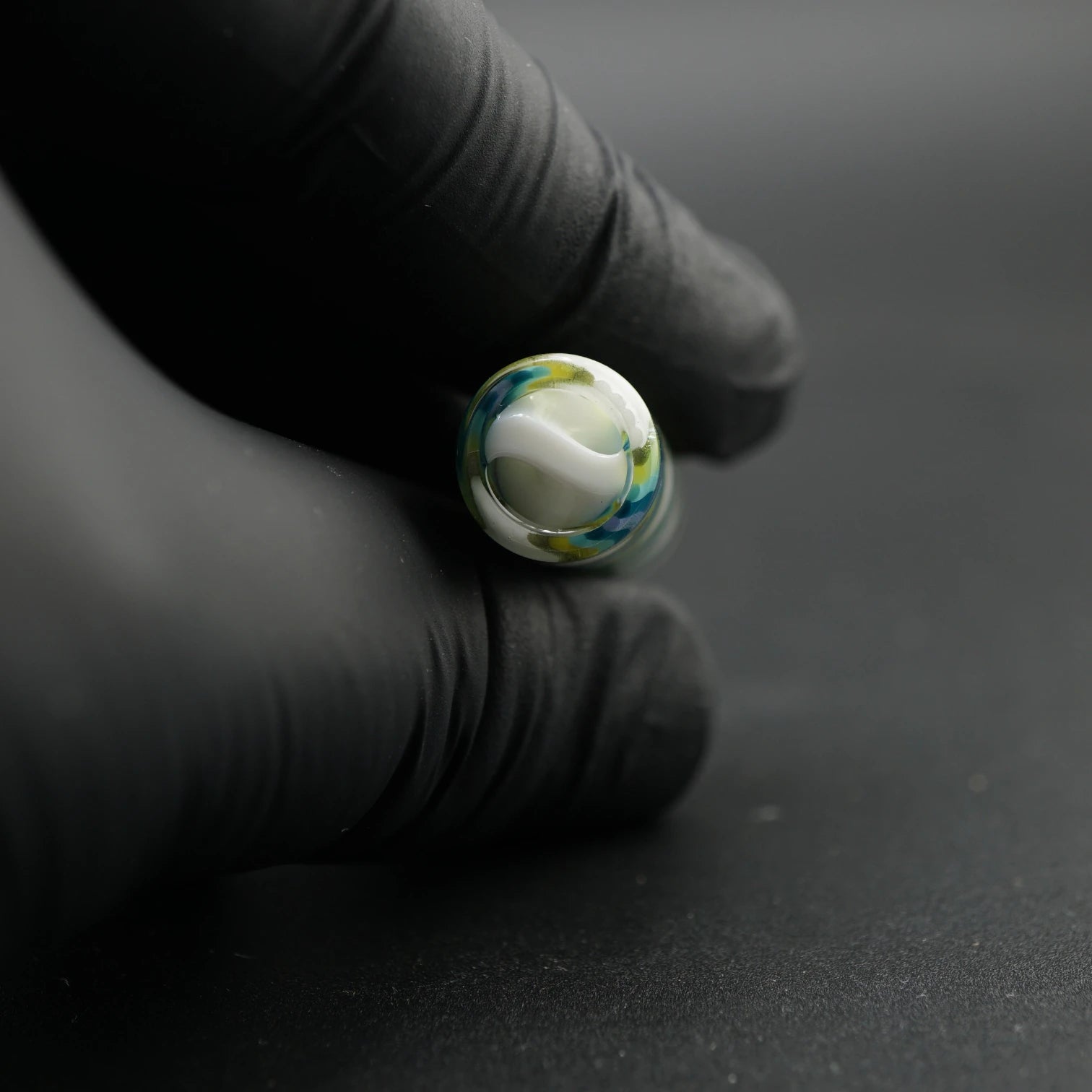 Close-up of the white spiral Rotini filter inside the Tyeglassarts Ocean Mist glass tip