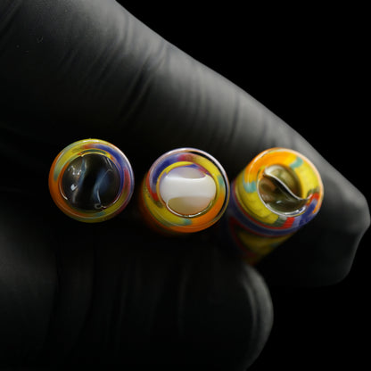 Top view of three Tyeglassarts Sunset Pulse glass tips with blue gold, white and gold Rotini filters